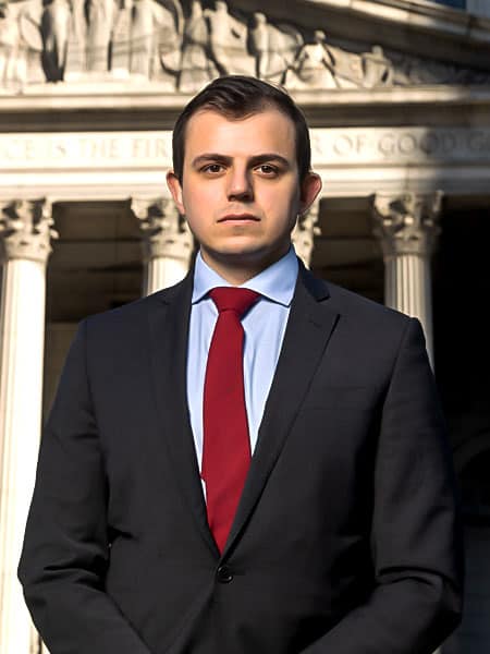 Zahar-Buniak-Profile-Pic Zahar Buniak, personal injury attorney, standing in front of of New York City court.